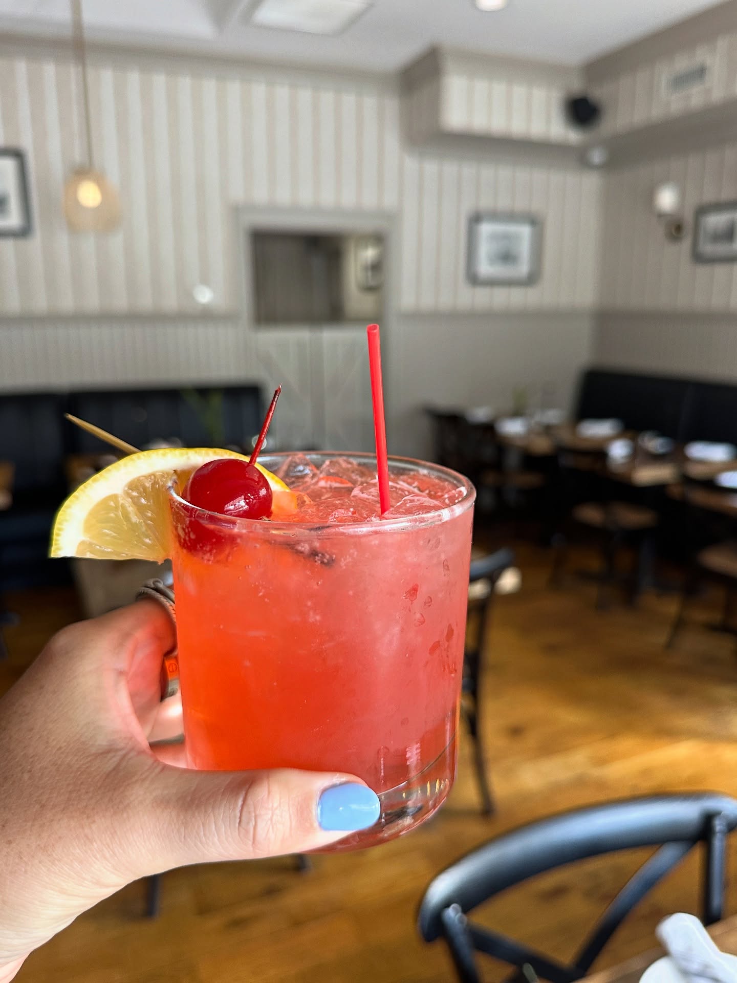A handcrafted cocktail in the warmly lit Cos Cobber dining room