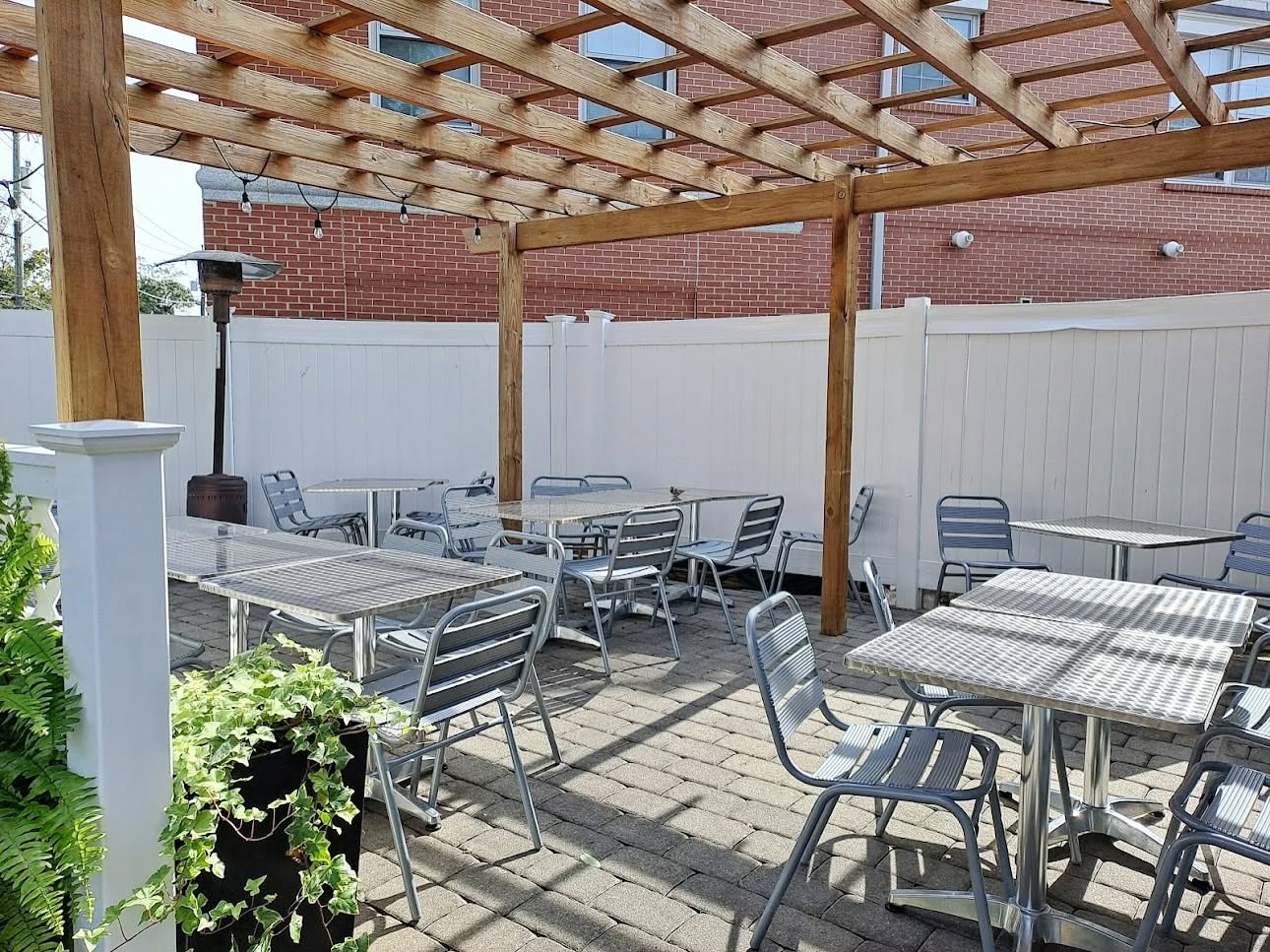 Outdoor patio seating under a wooden pergola